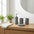 Set de 4 accesorios de baño de resina gris texturizada. Kit con dispensador, jabonera y vasos con acabado mate estilo piedra.